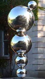 Detail of Eilís O’Connell RHA 'Apples and Atoms', Celebrating Ernest T.S. Walton 1903-95, Nobel Laureate, polished stainless steel, 2013, Trinity College Dublin Art Collections. Image courtesy and © the artist.