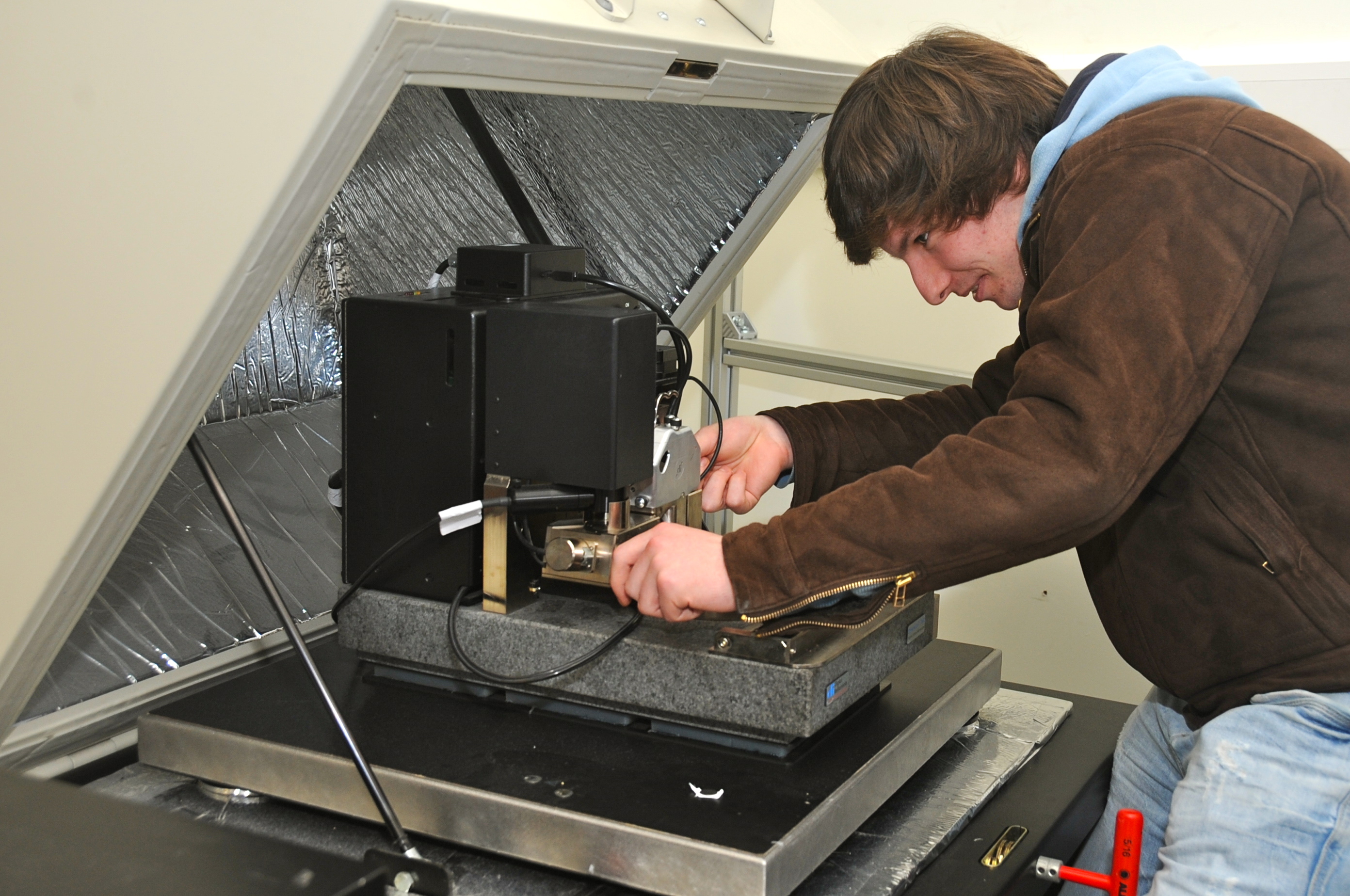 Students attending CRANN training session and performing Raman spectromicroscopy