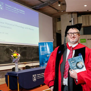 Picture of Nathan Hill with gown