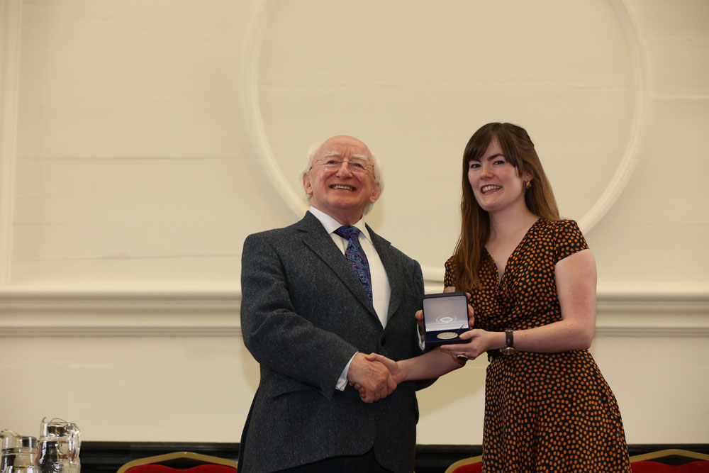 History of Art alumna, Sorcha Ni Lideadha presented with a gold medal by President of Ireland, Michael D Higgins