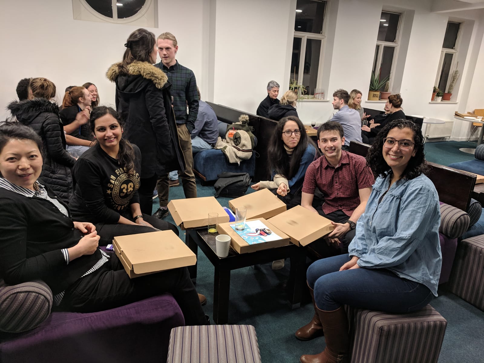 group photo eating pizza