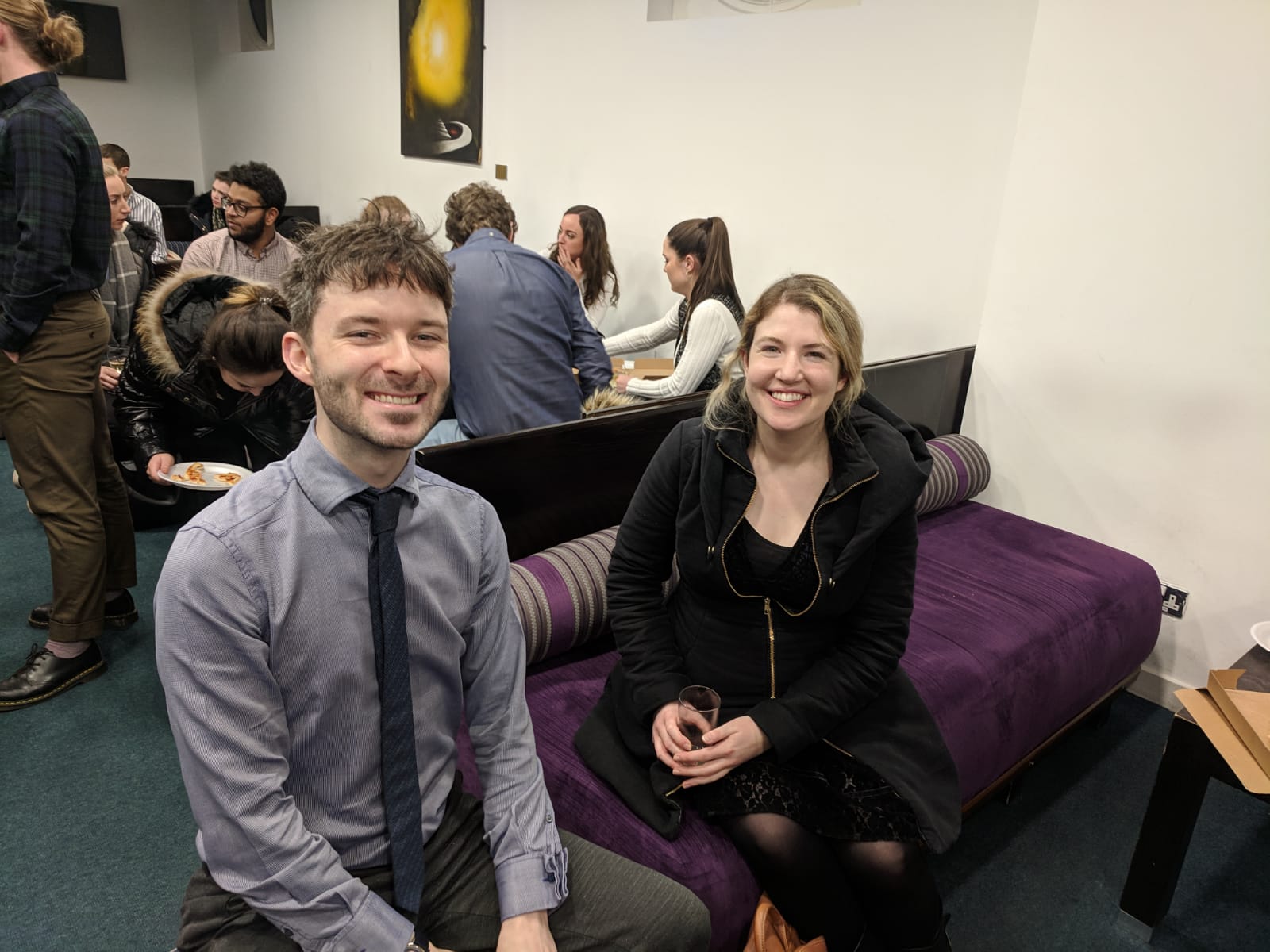 Academics enjoying pizza and wine