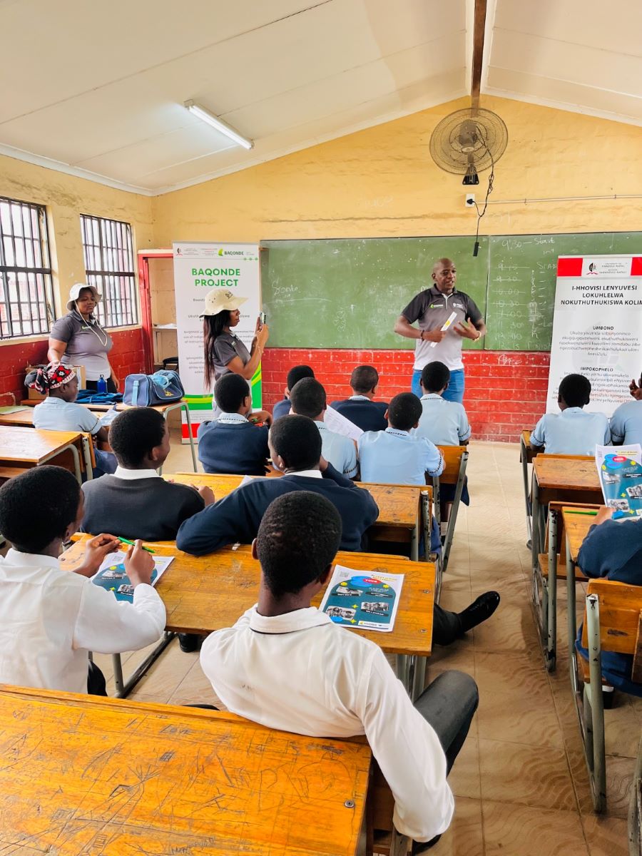 picture of teacher inside a classroom in Africa with a group or happy children