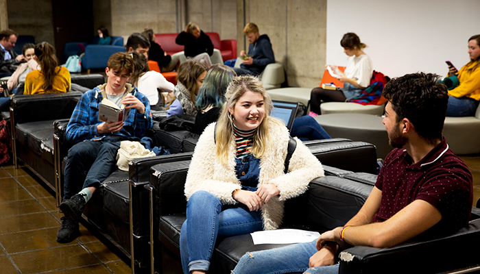 trinity students in the arts building foyer